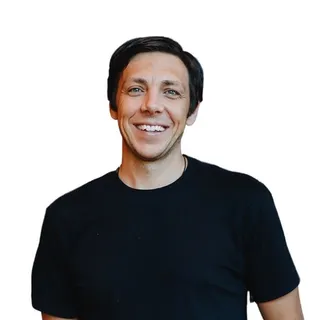 Reno Pace smiling in a black T-shirt
